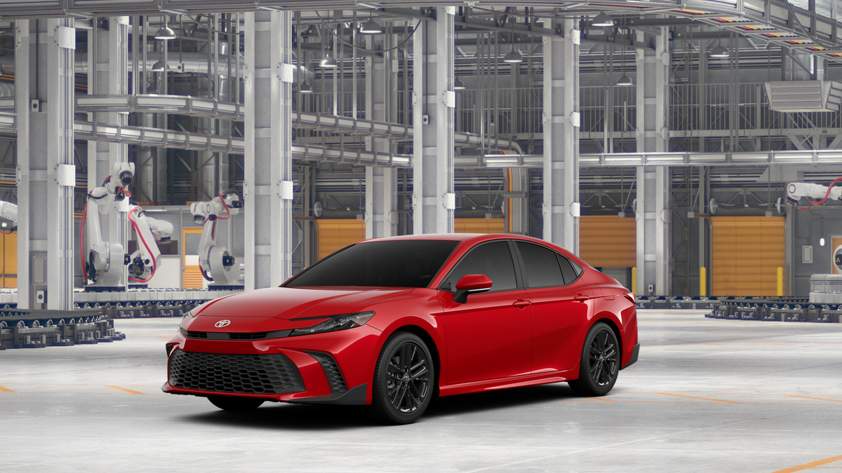 2026 Toyota Camry SE in Supersonic Red — front three-quarter view