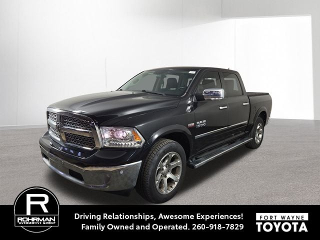 2018 RAM 1500 Laramie in Brilliant Black Crystal Pearlcoat — front three-quarter view