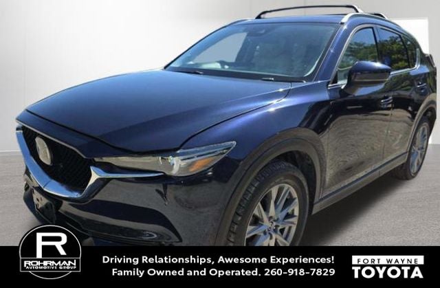 2021 Mazda Mazda CX-5 Grand Touring in Deep Crystal Blue Mica — front three-quarter view