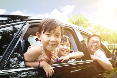 image of a family in a car
